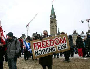 Key US-Canada bridge reopens as Ottawa protest persists