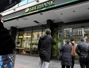 Russia’s largest lender Sberbank quits Europe