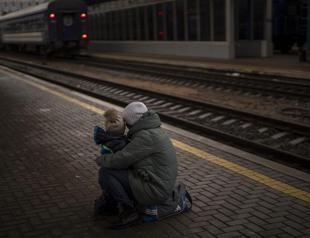 Tearful goodbyes at Kyiv train station during war in Ukraine