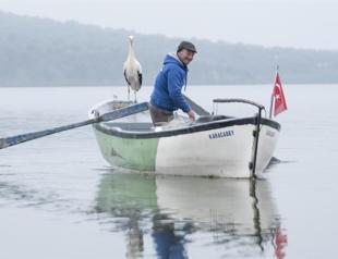 Stork visits old fisherman friend for 11th year running