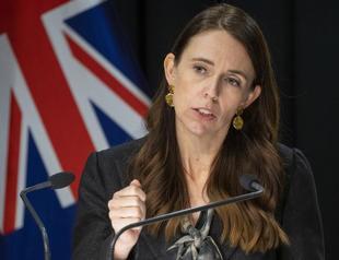 As virus cases go from 1 to 24,000, New Zealand changes tack