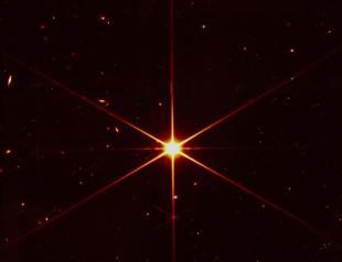 Space telescope’s image of star gets photobombed by galaxies