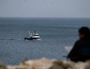Turkish fishermen in Black Sea closely watch navy boats