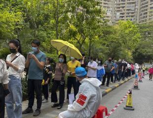China closes Guangzhou to most arrivals as outbreak spreads