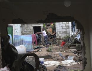 Without official aid, Durban flood victims dig themselves out