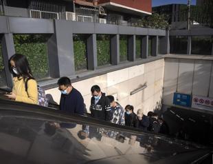 Anti-virus shutdowns in China spread as infections rise