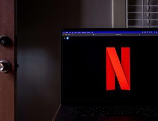 Netflix aims to curtail password sharing, considers ads