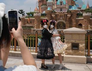 Hong Kong Disney opens as COVID eases; Shanghai deaths rise