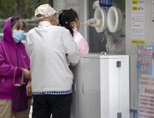 More Beijing classes go online in tightening of virus rules