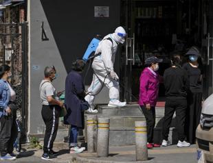Beijing preps COVID-19 hospital spaces, though new cases low