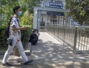 Hong Kong reopens beaches, Beijing relaxes quarantine rules