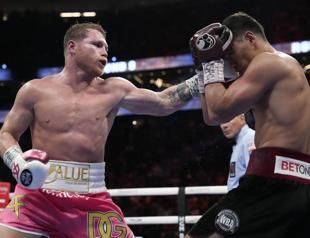 Bivol stuns Alvarez to retain title