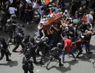Outcry after Israel police beat mourners at journalist funeral