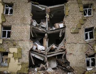 Russia presses battle for eastern Ukraine, claims key city surrounded