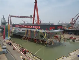 China launches high-tech aircraft carrier in naval milestone