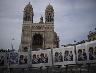 French voters elect parliamentarians, in test for Macron
