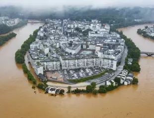 Hundreds of thousands evacuated in China after heaviest rains in decades