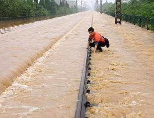 South China floods force tens of thousands to evacuate