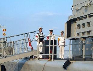 Japan protests Chinese navy sailing near disputed islands