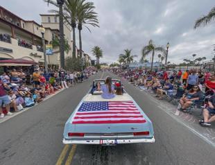 Uneasy US tries to fete a July 4 marred by parade shooting