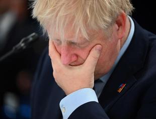 UK’s Johnson vows to stay in office after top ministers quit