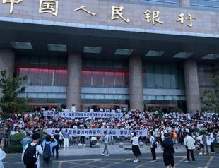 China detains alleged bank fraud ‘gang’ after rare mass protests