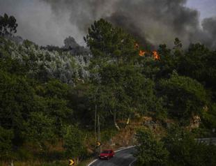 Wildfires blaze across sweltering southwest Europe