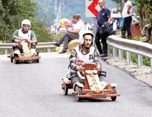 Locals race with handmade wooden cars