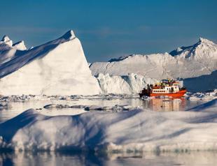 Greenland treads softly on tourism as icebergs melt