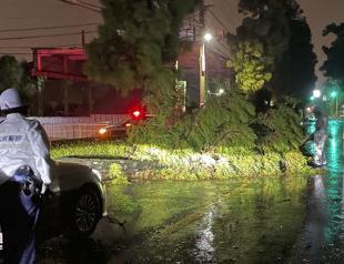 Storm floods parts of Japan, wipes out power, dozens hurt