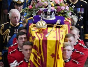 Queen put to rest with Philip, her parents in Windsor chapel