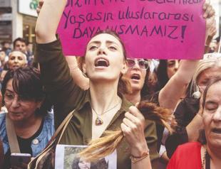 Woman cuts hair at Istanbul protest for Iran’s Amini