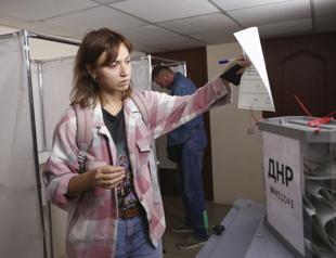 Kremlin stages votes in Ukraine, sees protests in Russia