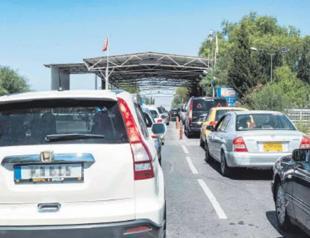 Greek Cypriot drivers fill up in north as prices soar