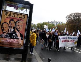 Macron agrees pension reform timeline as protests start