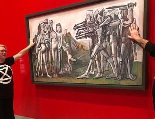 Protesters glue hands to cover of Picasso painting