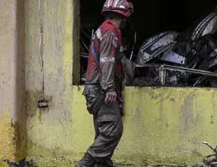 Neighbors, rescuers search for missing after Venezuela landslide