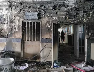 Iran prison fire toll doubles as protest tensions surge