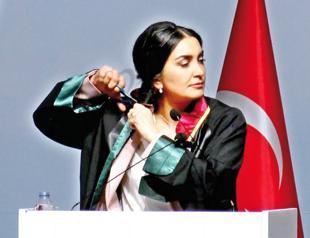 Lawyers cut hair for Iran’s Amini in bar’s General Assembly