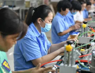 China’s factory activity contracts on Covid curbs