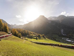 World’s longest passenger train winds through Swiss Alps