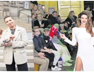 Turkish model catwalks with Danish PM