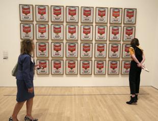 Australian climate protesters glue themselves to Warhol print