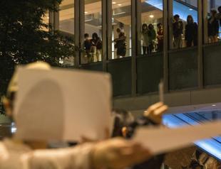 Hong Kong security chief warns against supporting China protests