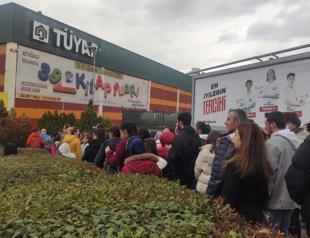 Visitors wait in long queues to enter book fair