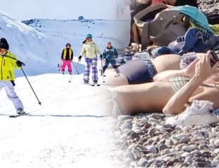 People sunbathe in south while north freezes
