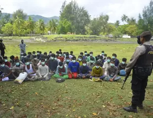58 weak Rohingya land on Indonesian beach after weeks at sea