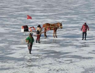 Visitors throng frozen lake famous for sleigh rides