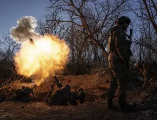 Battle rages in Ukraine town; Russia shakes up its military