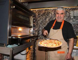 Man opens pizzeria after returning from UK